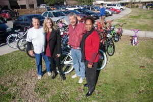 Social Service Staff with Community Volunteers Donating Bicycles