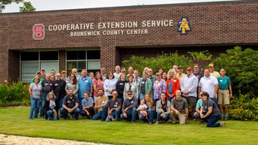 Brunswick County Center staff of the North Carolina Cooperative Extension in front of Building N.