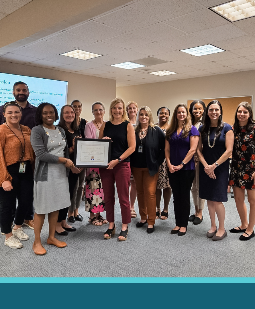 Brunswick County Social Services’ Child Welfare team receiving a certificate of recognition.